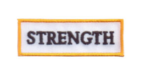Iron on embroidered badge with the word strenght 5 cm x 1.5 cm for training children for motivation